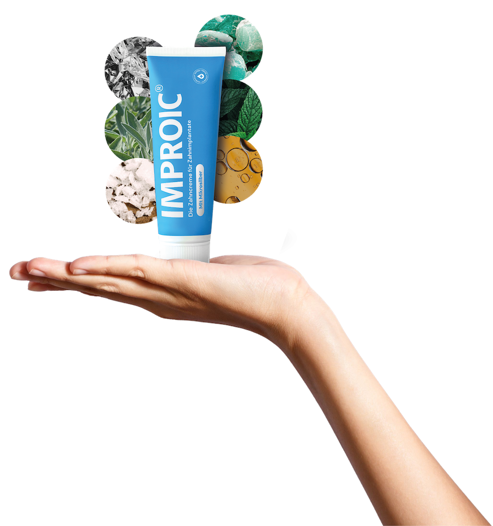 Toothpaste tube standing on a hand